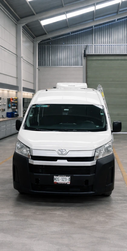 Professional installation of electric air conditioning system on a van at Cofor workshop